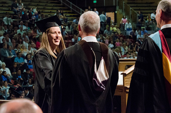 Students recieve their Diplomas during the College of Business and Communication Convocation.
