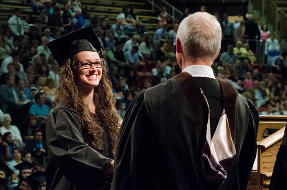Students recieve their Diplomas during the College of Business and Communication Convocation.