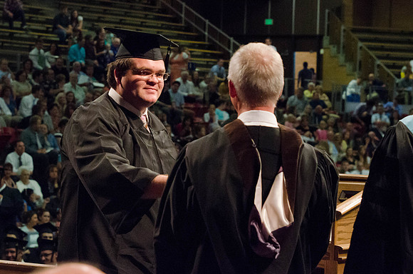 Students recieve their Diplomas during the College of Business and Communication Convocation.