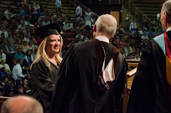 Students recieve their Diplomas during the College of Business and Communication Convocation.