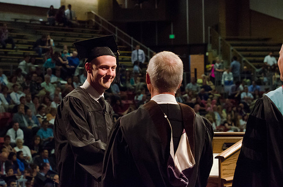 Students recieve their Diplomas during the College of Business and Communication Convocation.