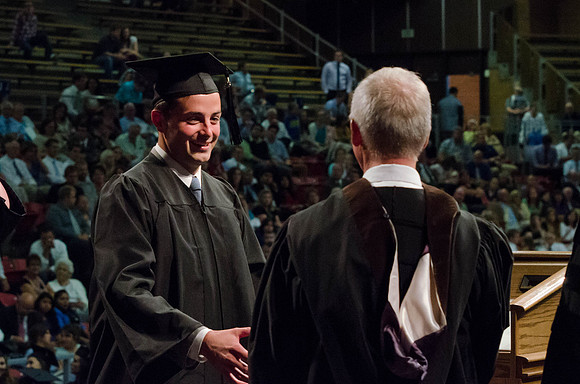 Students recieve their Diplomas during the College of Business and Communication Convocation.