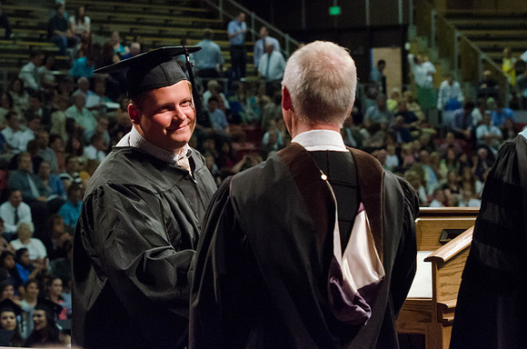 Students recieve their Diplomas during the College of Business and Communication Convocation.