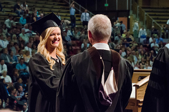 Students recieve their Diplomas during the College of Business and Communication Convocation.
