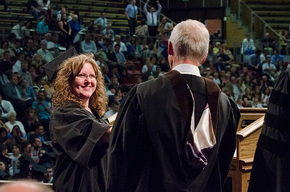 Students recieve their Diplomas during the College of Business and Communication Convocation.