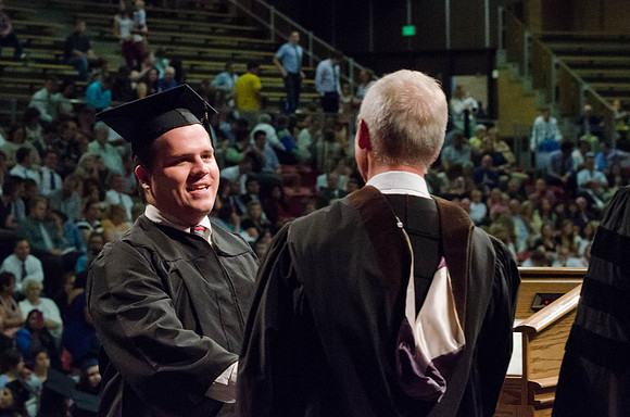 Students recieve their Diplomas during the College of Business and Communication Convocation.