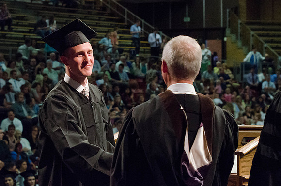 Students recieve their Diplomas during the College of Business and Communication Convocation.