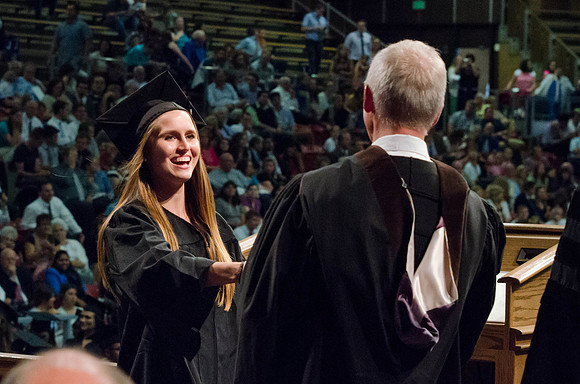 Students recieve their Diplomas during the College of Business and Communication Convocation.