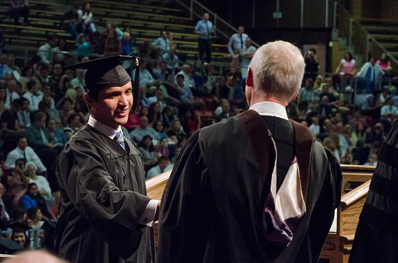 Students recieve their Diplomas during the College of Business and Communication Convocation.