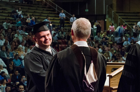 Students recieve their Diplomas during the College of Business and Communication Convocation.