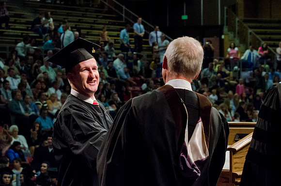 Students recieve their Diplomas during the College of Business and Communication Convocation.