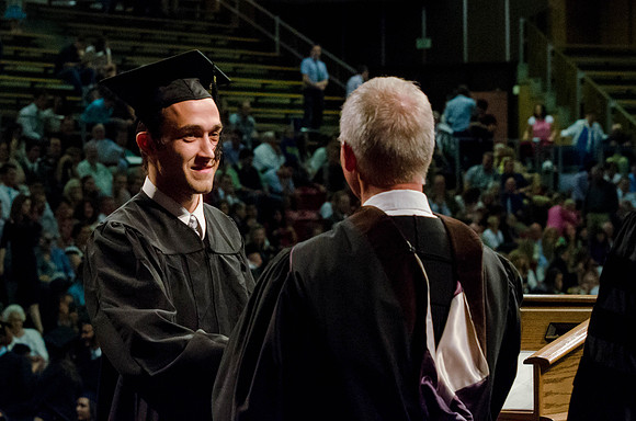 Students recieve their Diplomas during the College of Business and Communication Convocation.