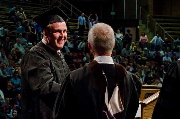 Students recieve their Diplomas during the College of Business and Communication Convocation.