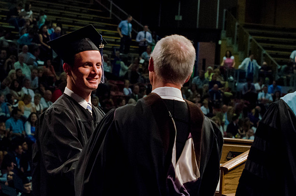 Students recieve their Diplomas during the College of Business and Communication Convocation.