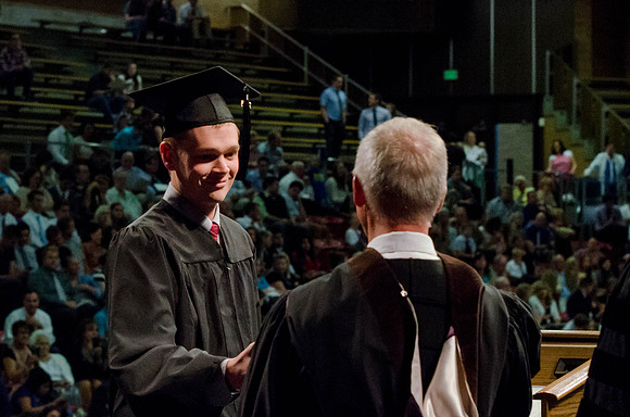 Students recieve their Diplomas during the College of Business and Communication Convocation.