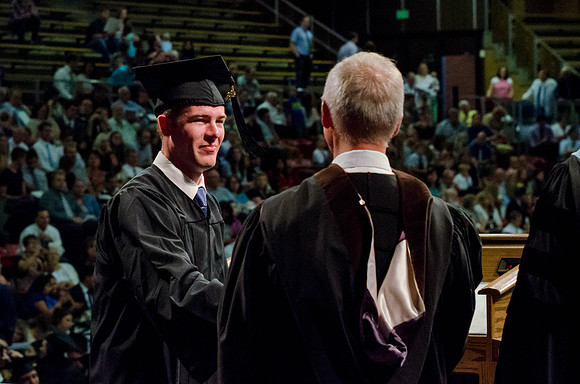 Students recieve their Diplomas during the College of Business and Communication Convocation.