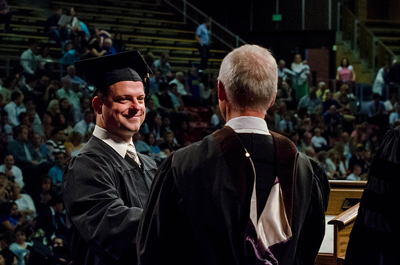 Students recieve their Diplomas during the College of Business and Communication Convocation.
