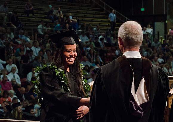 Students recieve their Diplomas during the College of Business and Communication Convocation.