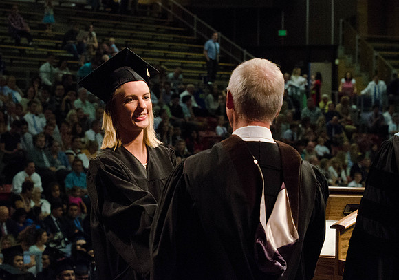 Students recieve their Diplomas during the College of Business and Communication Convocation.