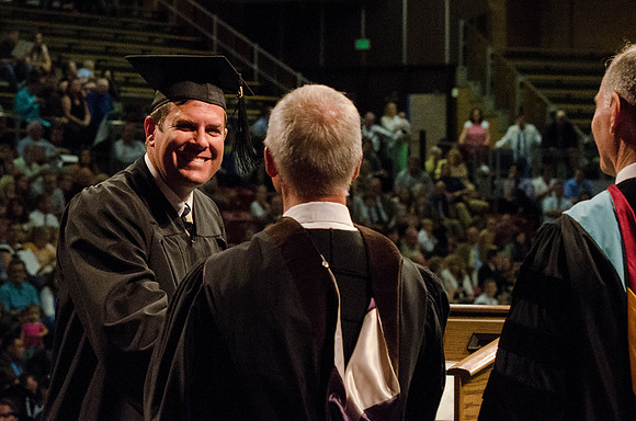 Students recieve their Diplomas during the College of Business and Communication Convocation.