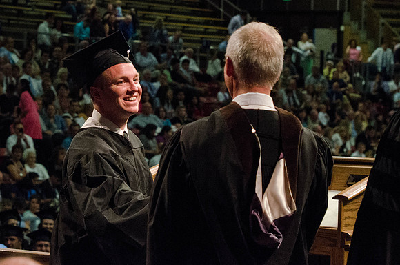 Students recieve their Diplomas during the College of Business and Communication Convocation.