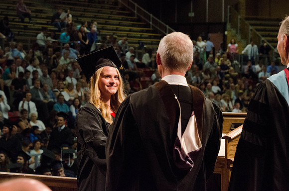 Students recieve their Diplomas during the College of Business and Communication Convocation.