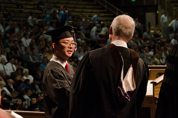 Students recieve their Diplomas during the College of Business and Communication Convocation.