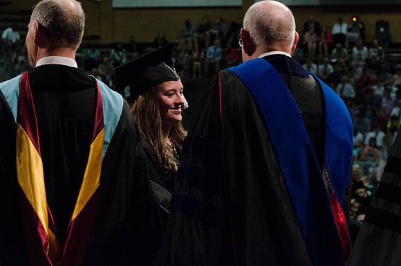 Students recieve their Diplomas during the College of Business and Communication Convocation.