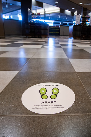 Stickers on the ground in the Crossroads saying to stand 6ft apart and practice physical distancing during the 2020 COVID-19 pandemic.
