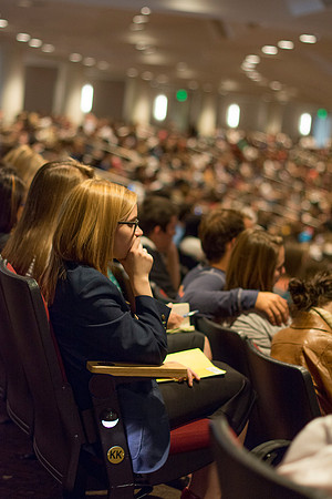 Students listens and takes notes at devotional.