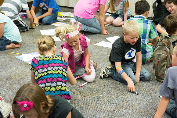 Children participate in games that help build unity and teamwork. Photo by Erik Hill.