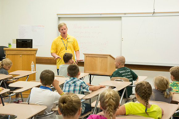 The Children discuss what their favorite part of Education Week has been so far. Photo by Erik Hill.