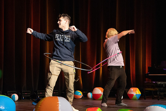 Students participate of the New Student Talent Show in the Hart building.