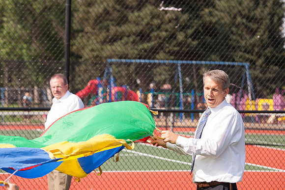 The IT Department, along with family and friends, gather at Porter Park to eat, socialize, and play games.