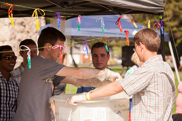 The IT Department, along with family and friends, gather at Porter Park to eat, socialize, and play games.