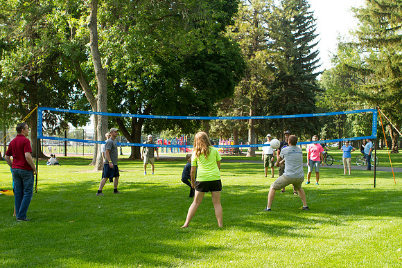 The IT Department, along with family and friends, gather at Porter Park to eat, socialize, and play games.