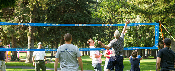 The IT Department, along with family and friends, gather at Porter Park to eat, socialize, and play games.