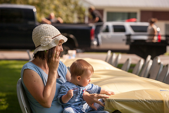 The IT Department, along with family and friends, gather at Porter Park to eat, socialize, and play games.