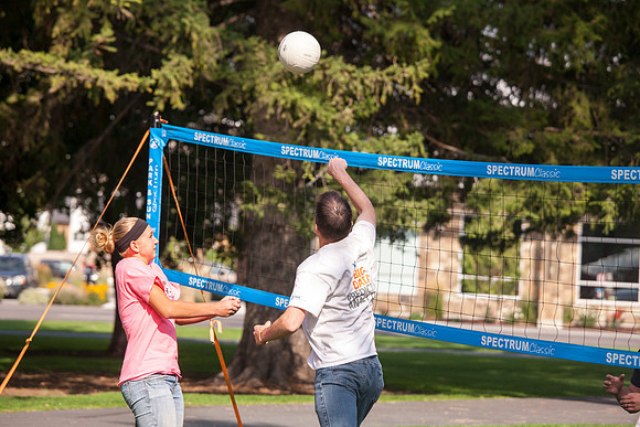 The IT Department, along with family and friends, gather at Porter Park to eat, socialize, and play games.