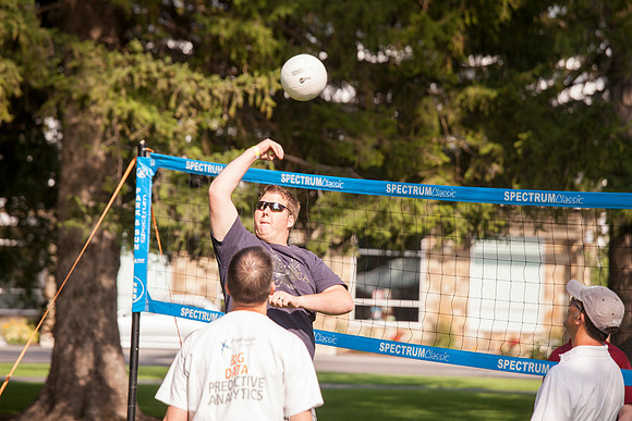 The IT Department, along with family and friends, gather at Porter Park to eat, socialize, and play games.
