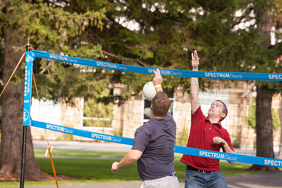 The IT Department, along with family and friends, gather at Porter Park to eat, socialize, and play games.