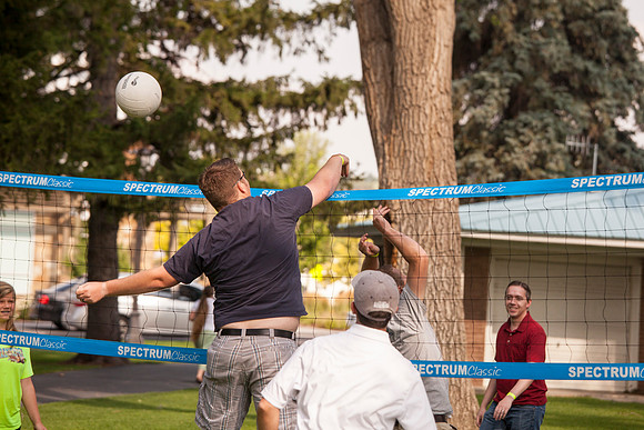 The IT Department, along with family and friends, gather at Porter Park to eat, socialize, and play games.