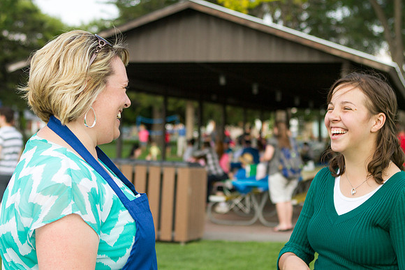 The IT Department, along with family and friends, gather at Porter Park to eat, socialize, and play games.