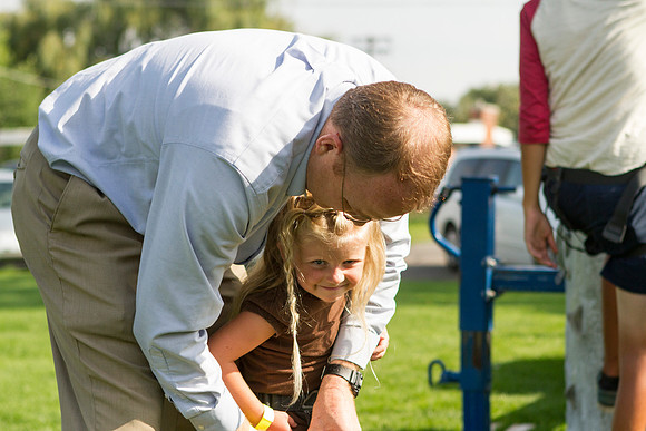 The IT Department, along with family and friends, gather at Porter Park to eat, socialize, and play games.