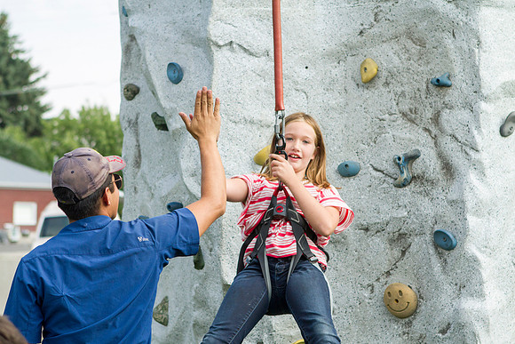 The IT Department, along with family and friends, gather at Porter Park to eat, socialize, and play games.
