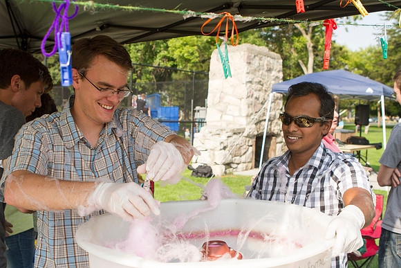 The IT Department, along with family and friends, gather at Porter Park to eat, socialize, and play games.