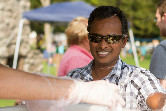 The IT Department, along with family and friends, gather at Porter Park to eat, socialize, and play games.