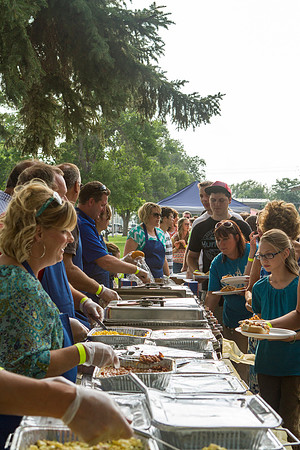 The IT Department, along with family and friends, gather at Porter Park to eat, socialize, and play games.