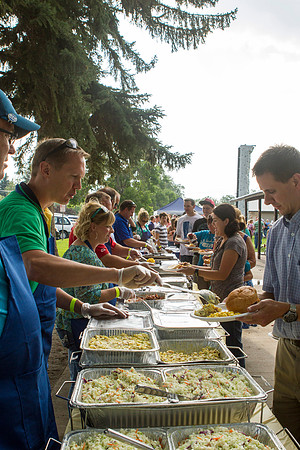 The IT Department, along with family and friends, gather at Porter Park to eat, socialize, and play games.