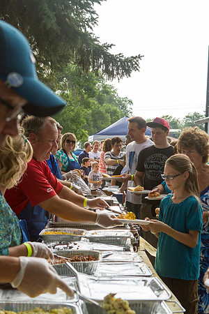 The IT Department, along with family and friends, gather at Porter Park to eat, socialize, and play games.